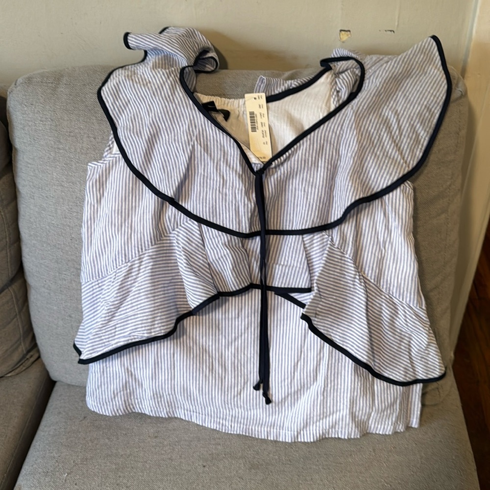 This is a super sweet sleeveless top in blue and white stripes